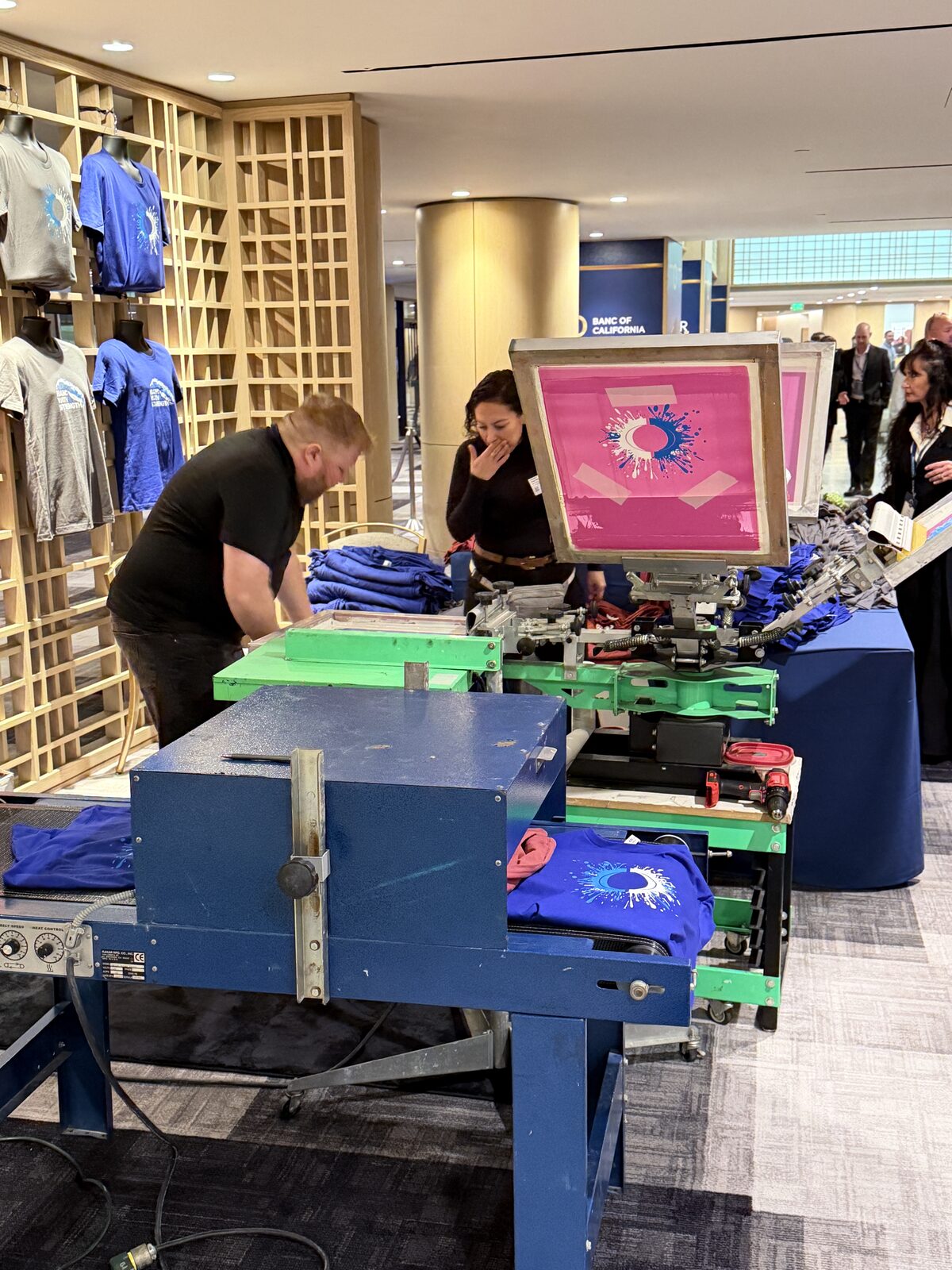 Merch Troop live screen-printing station running at a Orange County event